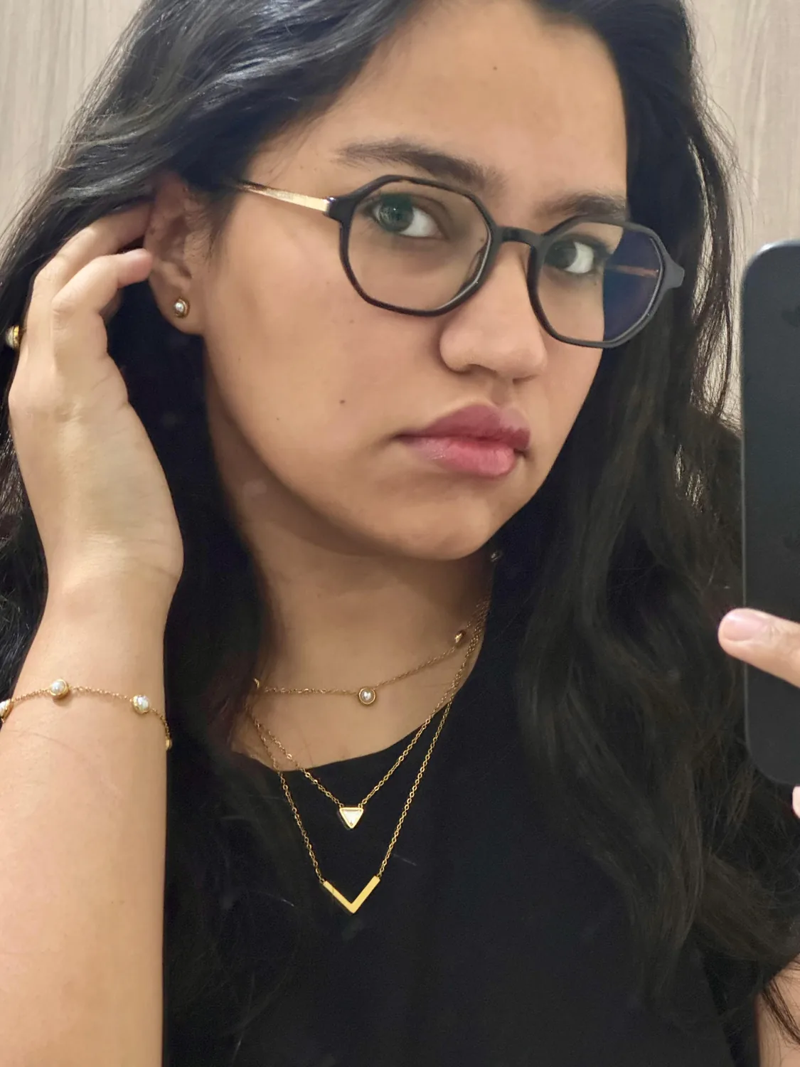 Customer wearing a necklace from Alankara