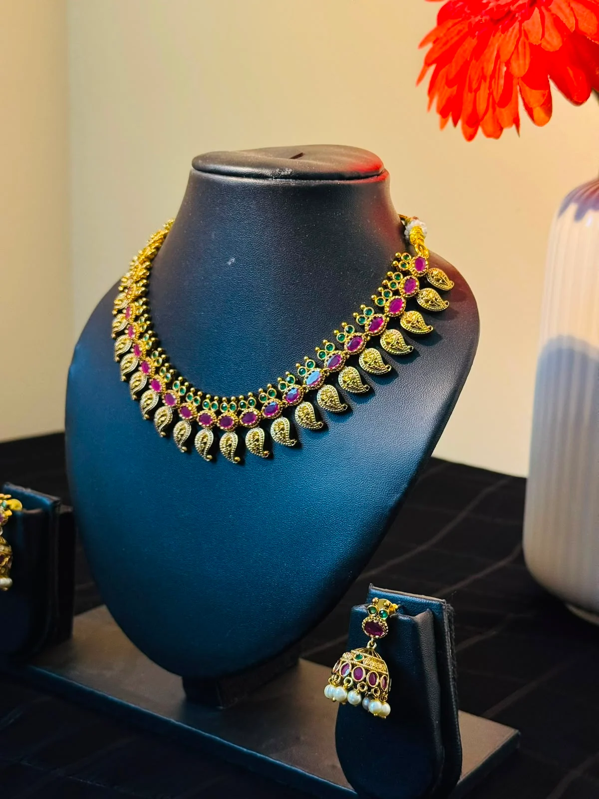 Latest Alankara mango-motif imitation-gold necklace with ruby and green stones and matching jhumka