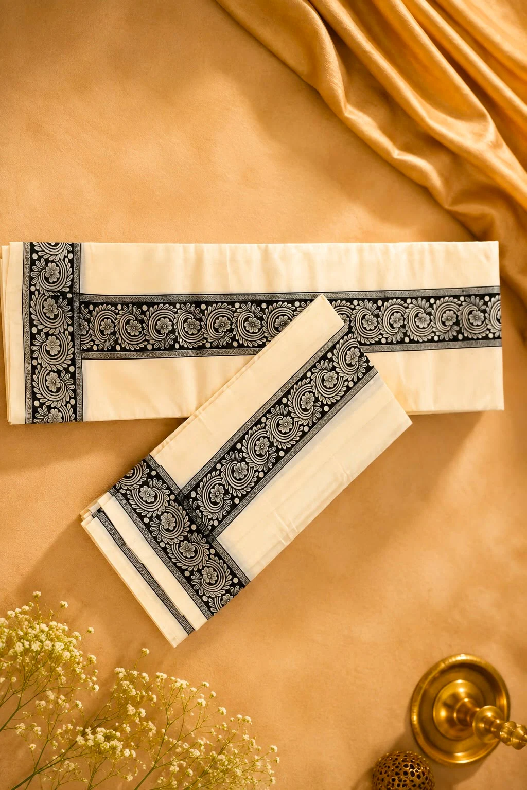 Ivory Kerala set mundu with a black floral woven border