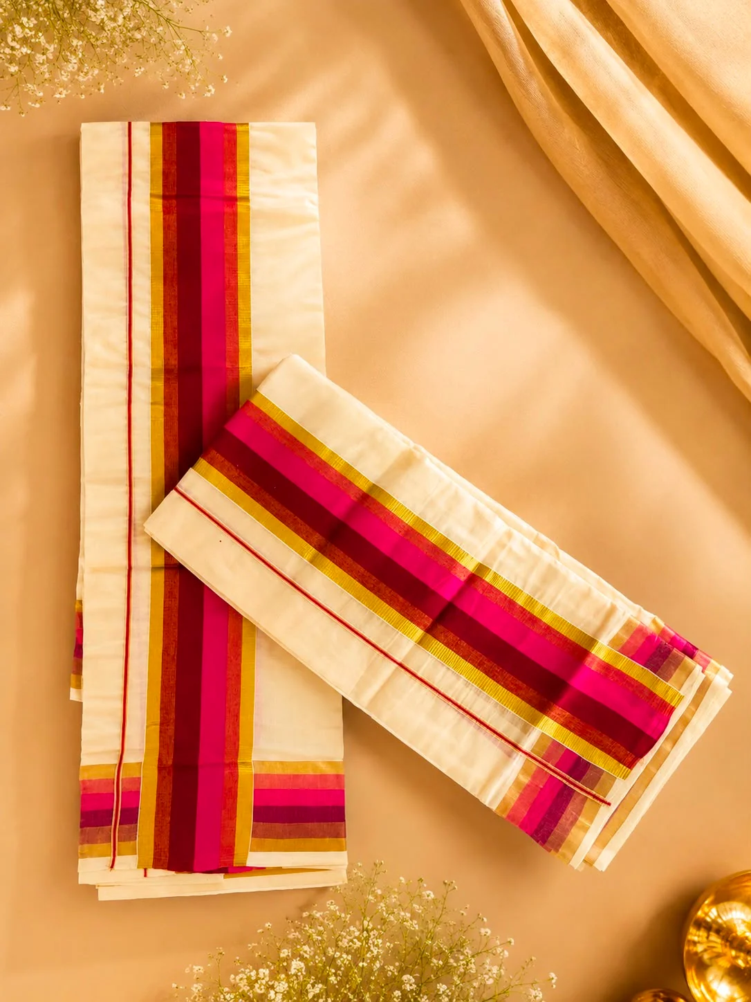 Ivory Kerala set mundu with magenta, maroon and gold woven borders
